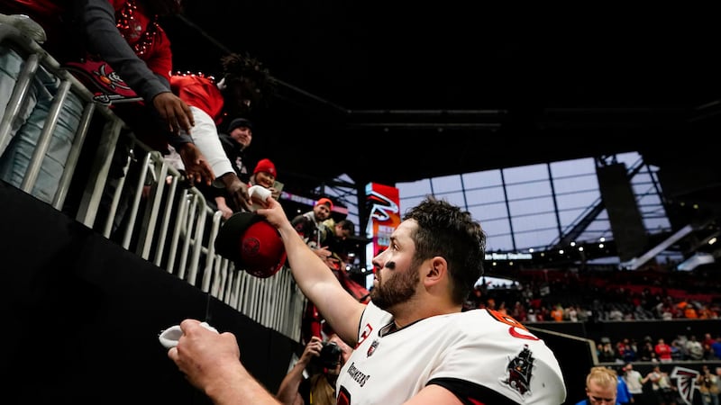 Tampa Bay Buccaneers quarterback Baker Mayfield (6) celebrates with fans after defeating the...
