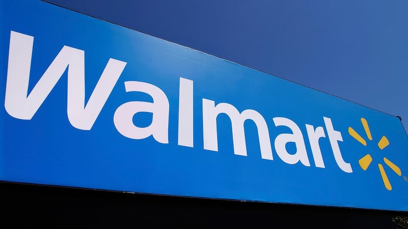 FILE - In this May 16, 2011 file photo, the Walmart logo is displayed on a store in...