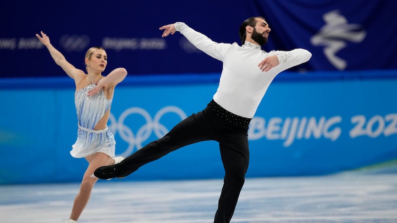 Ashley Cain-Gribble and Timothy Leduc, of the United States, compete in the pairs short...