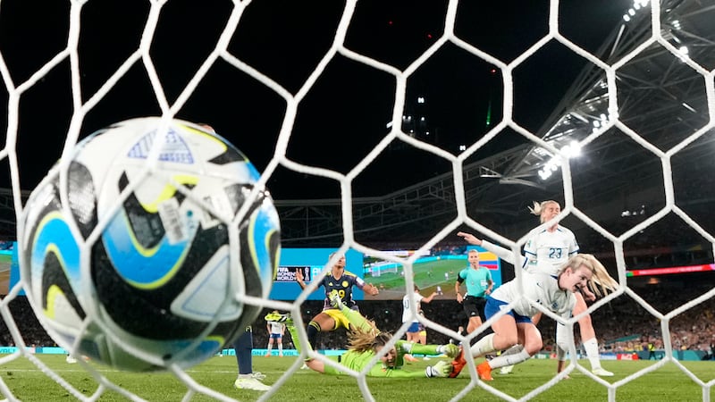 The ball hits the back of net as England's Lauren Hemp, right, scores against Colombia during...
