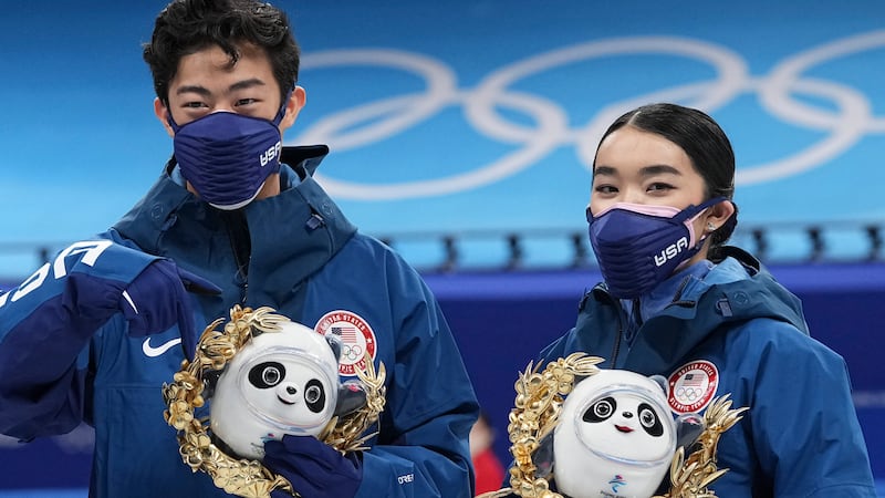 Silver medalists Karen Chen and Nathan Chen pose for a photo after the team event in the...