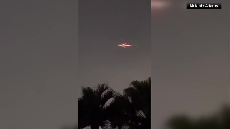 A witness caught on camera a plane seemingly on fire Thursday night in Miami. The cargo plane...