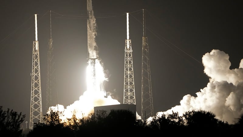 A SpaceX Falcon 9 rocket, with a payload including two lunar rovers from Japan and the United...