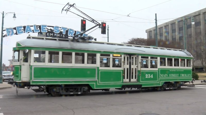 A trolley passes by the Beale Street sign in downtown Memphis.