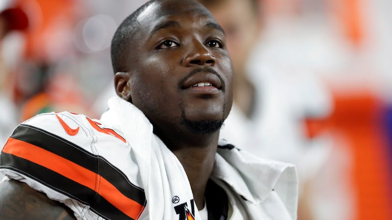 FILE - In this Aug. 8, 2019, file photo, Cleveland Browns defensive end Chris Smith (50) sits...