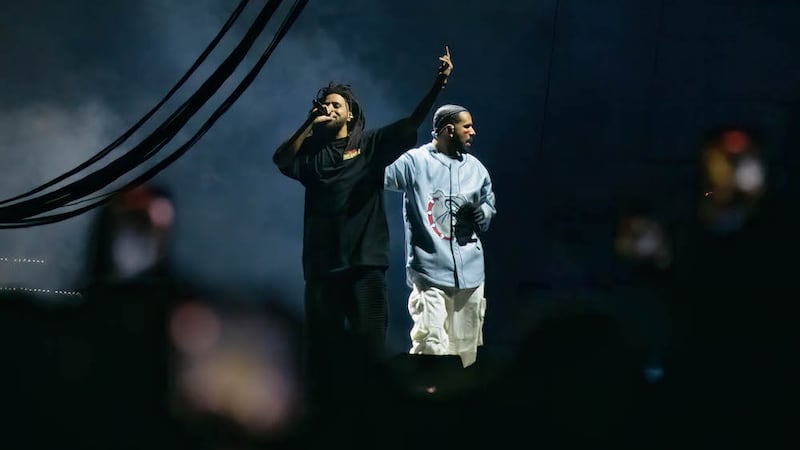 J. Cole (L) and Drake (R) perform during the Dreamville Festival at Dorothea Dix Park on April...