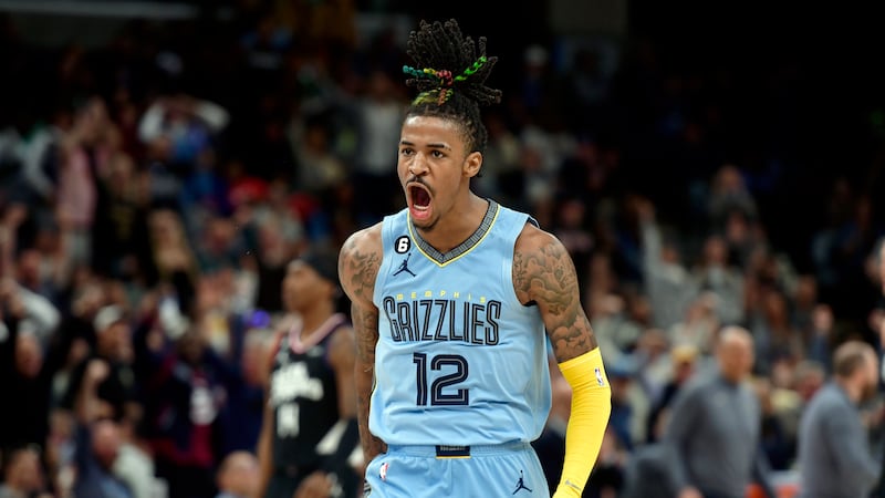 Memphis Grizzlies guard Ja Morant reacts in the second half of an NBA basketball game against...