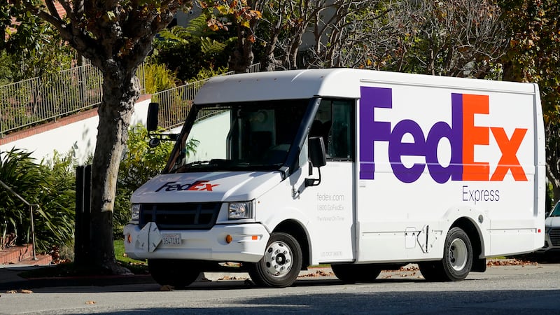 A FedEx truck makes deliveries in San Francisco, Saturday, Oct. 29, 2022. (AP Photo/Jeff Chiu)