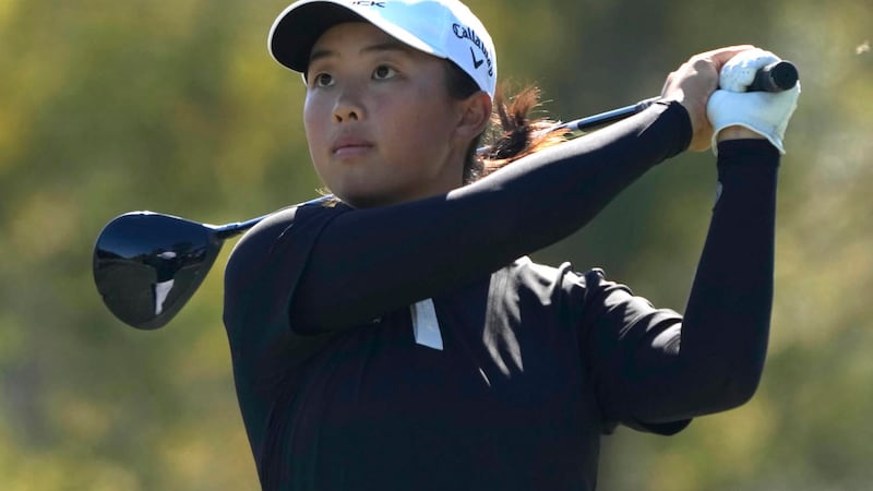 Ruoning Yin, of China, plays her shot from the third tee during the final round of the LPGA...