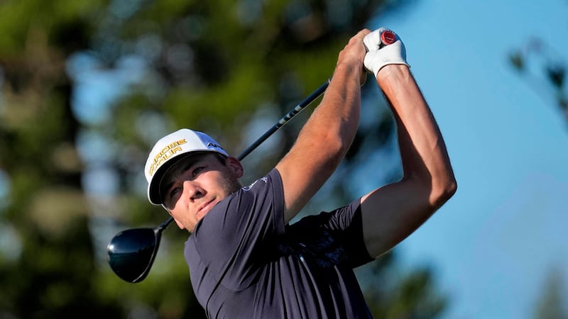 Sam Burns hits from the third tee during the final round of The Sentry golf event, Sunday,...