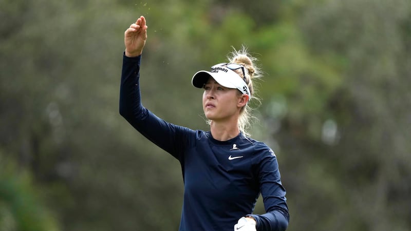 Nelly Korda checks the wind on the third tee during the first round of the LPGA CME Group Tour...
