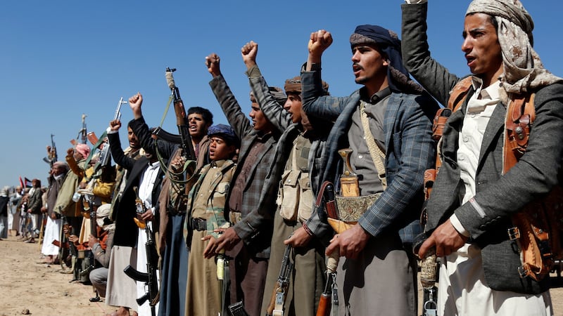 Houthi fighters and tribesmen stage a rally against the U.S. and the U.K. strikes on...