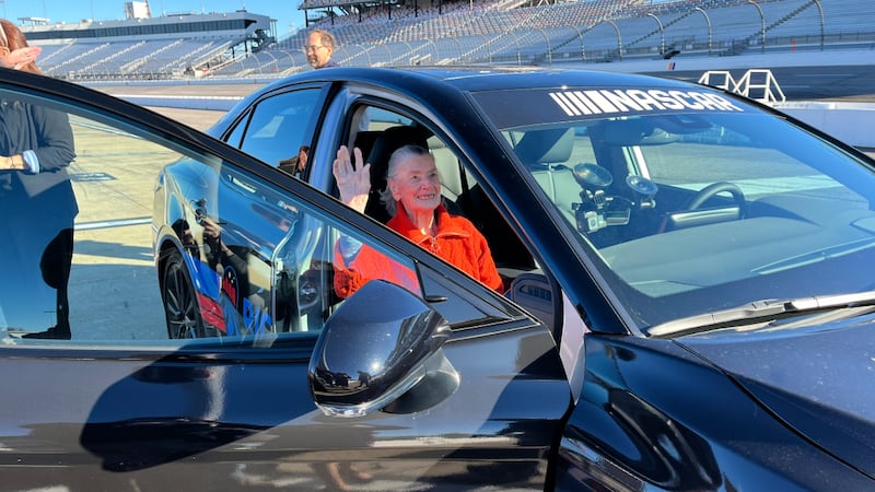 Ms. Bindy Gralow, a 102-year-old race fan, fulfilled a bucket-list item by riding around...