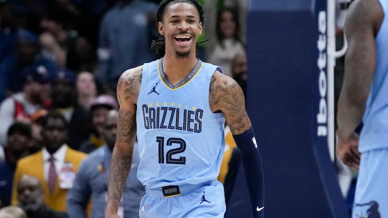 Memphis Grizzlies guard Ja Morant (12) reacts after his slam dunk in the final seconds of...